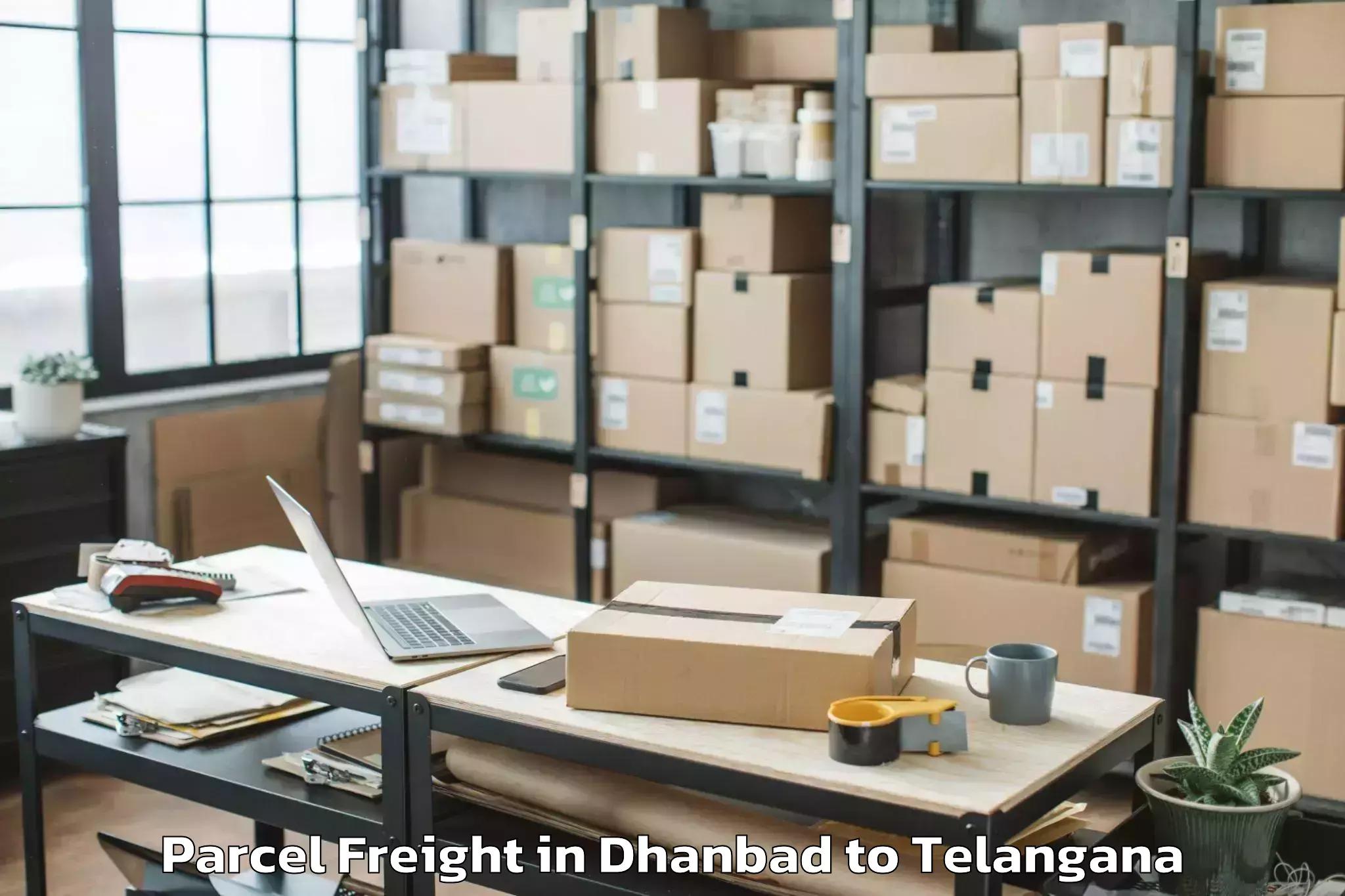 Book Dhanbad to Mamda Parcel Freight Online